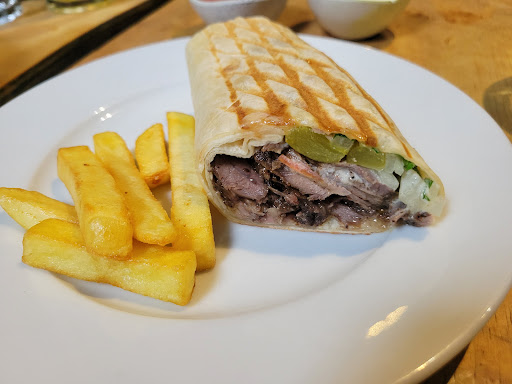 Photo of Hiba Street Food - 10 Tottenham St, London W1T 4RD, UK