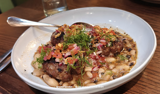 Photo of Honey & Smoke Grill House - 216 Great Portland St, London W1W 5QW, UK
