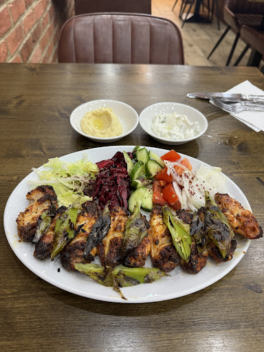 Photo of Woody Grill Camden - 25 Camden High St, London NW1 9DL, UK