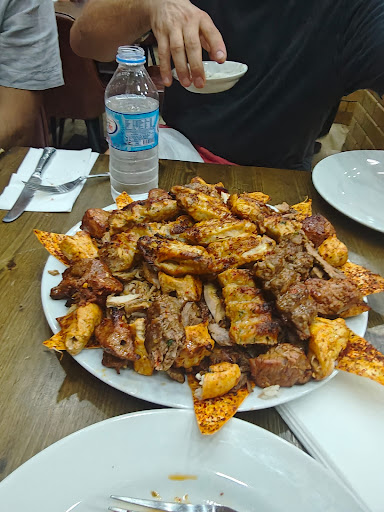 Photo of Woody Grill Camden - 25 Camden High St, London NW1 9DL, UK