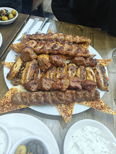 Photo of Woody Grill Camden - 25 Camden High St, London NW1 9DL, UK