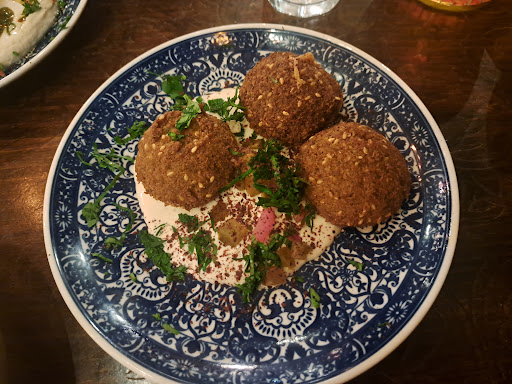 Photo of Yalla Yalla - 12 Winsley St, London W1W 8HQ, UK
