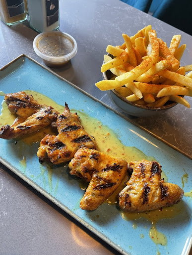 Photo of Moe's Peri Peri Grill - 11 Heritage Ave, London NW9 5FW