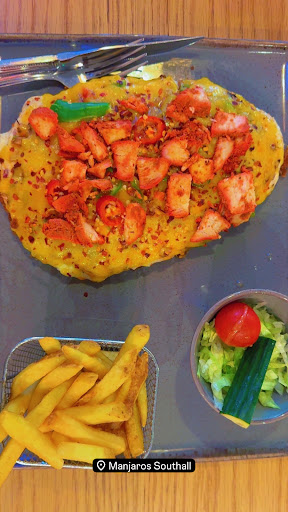 Photo of Manjaros - Restaurant in Southall - 1-3 Beaconsfield Rd, Southall UB1 1BA